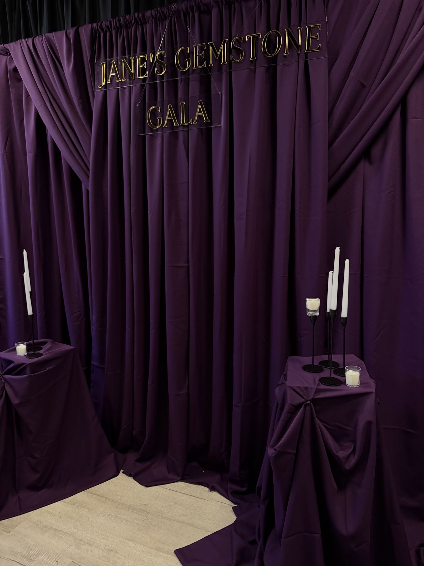 Deep purple draped backdrop for Jane's Gemstone Gala